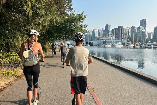 Stanley Park Seawall E-scooter Rental with Self Guided map - The home stretch: beaches, statues, and seawall views