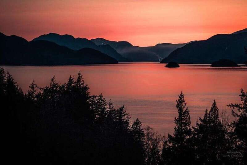 Vancouver: Sunset Boat Cruise with Complementary Bubbly - Watching the coastal cliffs from the upper deck